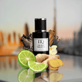 D'QAR Dubai Nights fragrance bottle with bergamot, ginger, and agarwood on a blurred city background.